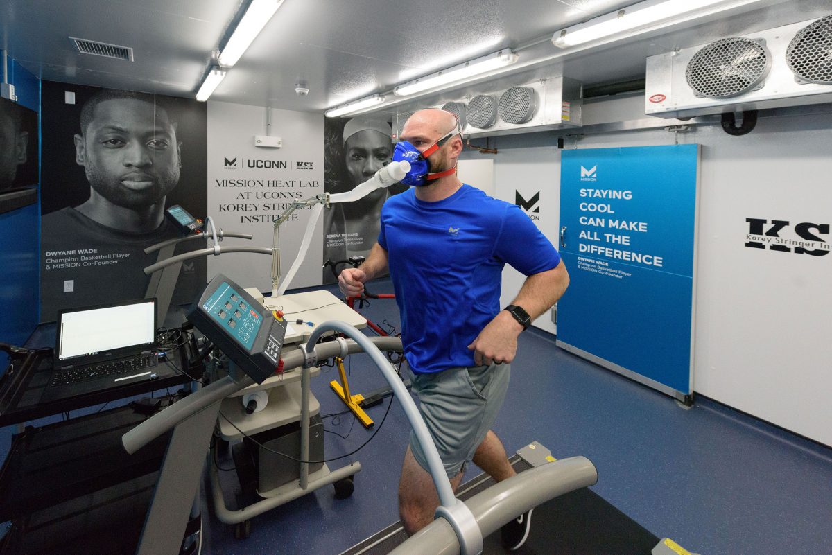Ryan Curtis, KSI associate director of athlete performance and safety, runs on a treadmill at the Mission Heat Lab at the Korey Stringer Institute at Gampel Pavilion